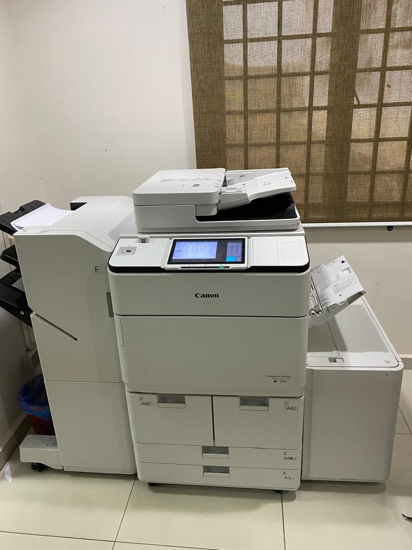 Canon multifunction printer with finisher installed in an office