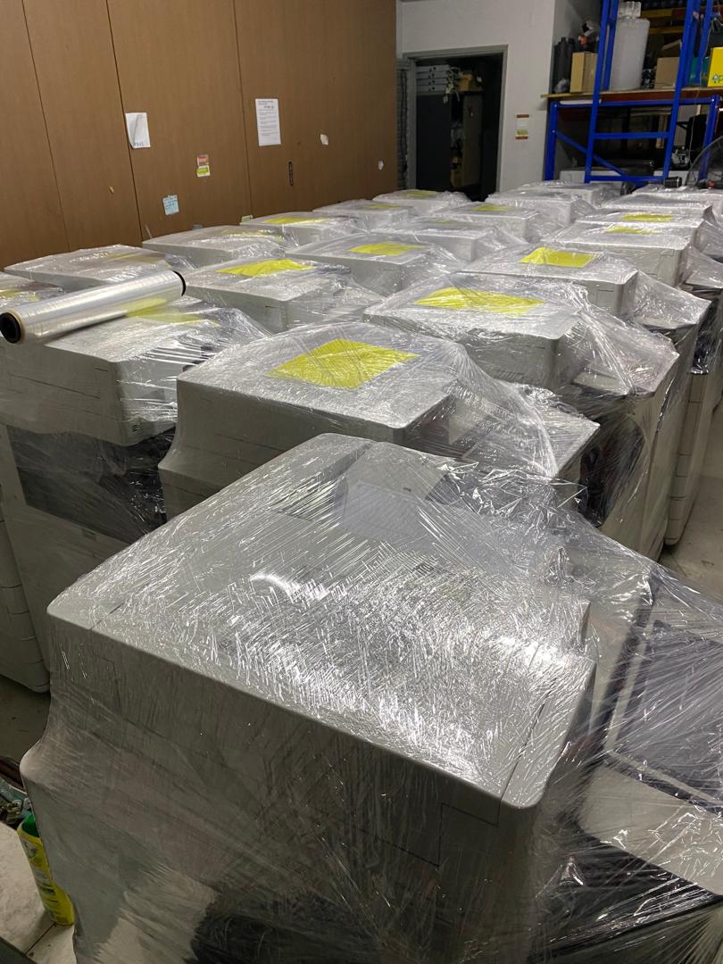 Rows of wrapped Canon copiers in the IRC Galaxy Solution warehouse