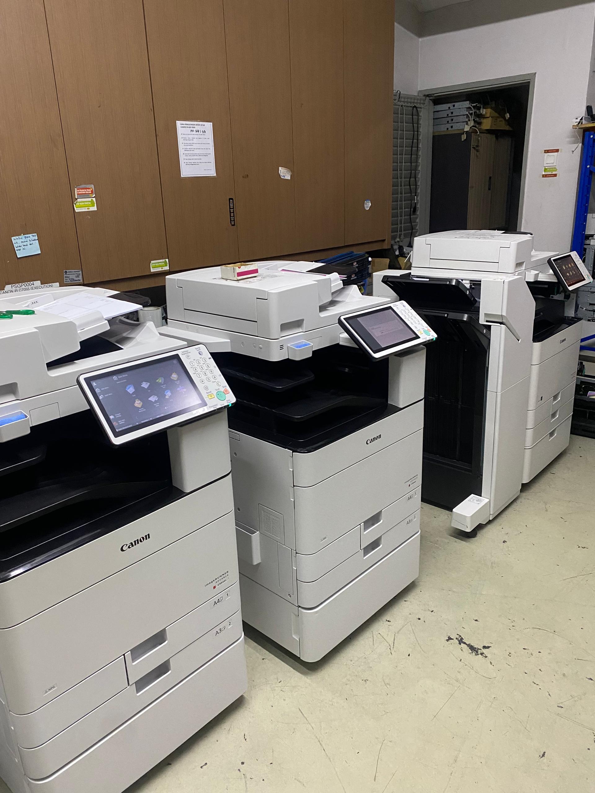 Multiple Canon imageRUNNER ADVANCE copiers set up in a client server room